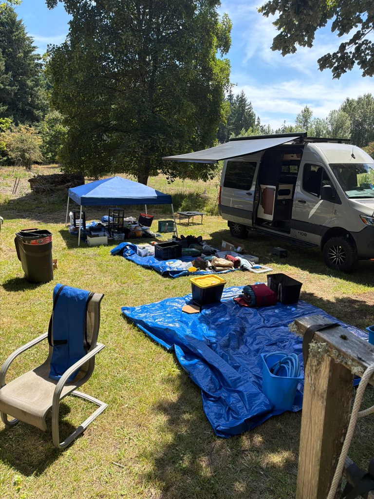 Stuff on tarps outside the van while we pack