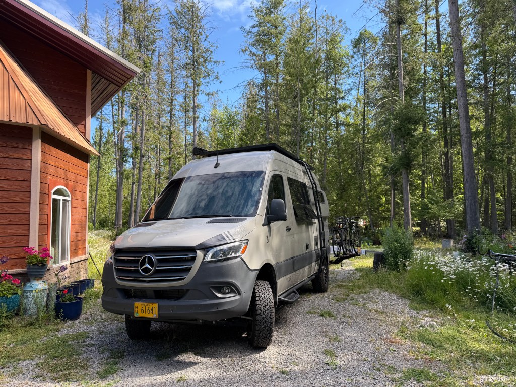 Hazelnut Romy (the van) parked outisde a house in Idaho