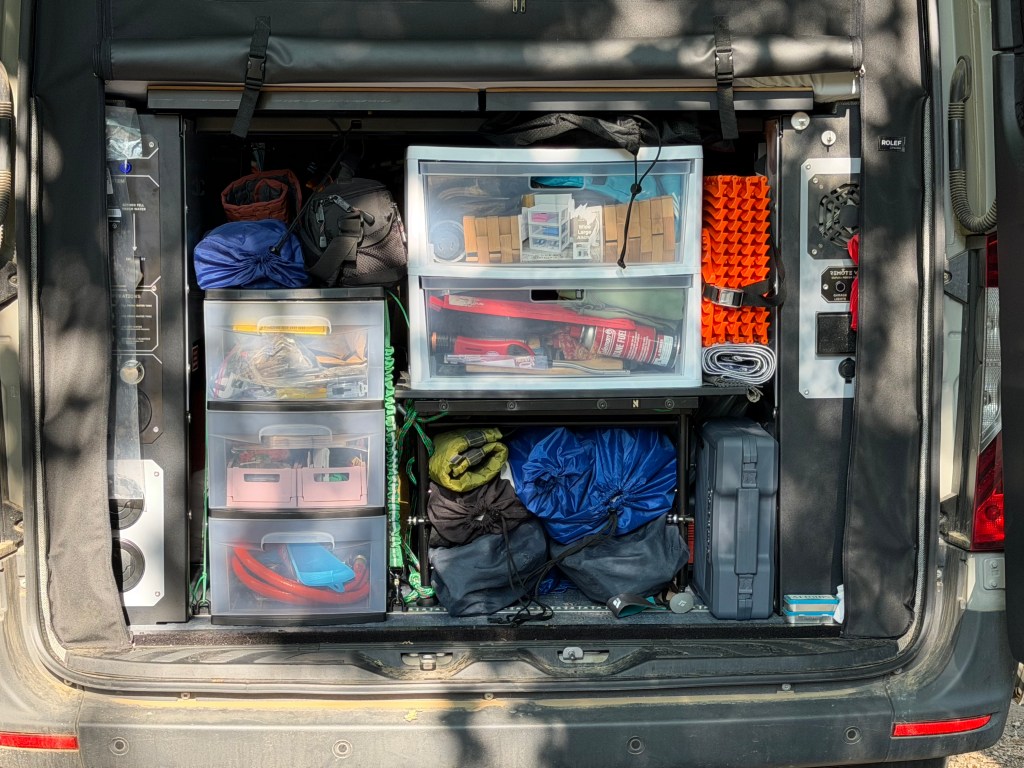 Our (very organized) back of the van... camping stuff, drawers, etc.